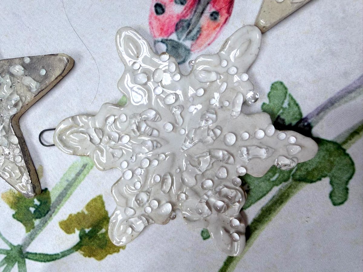 Handcrafted white ceramic snowflake ornament with clear glass accents