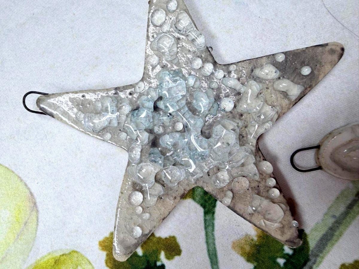 Handcrafted ceramic star ornament with clear glass accents